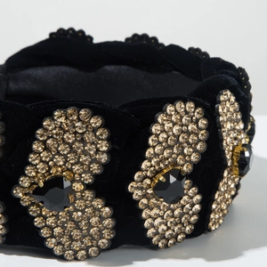 Macro di cerchietto in velluto nero con strass champagne e pietre preziose scure