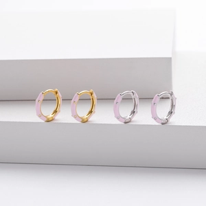 Detailed close-up of S925 silver hoop earrings with pink enamel on geometric stands