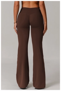 Rear view of high-waisted dark brown flare yoga pants with V-shaped back seam detail