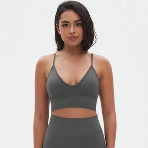 Detailed texture of seamless dark grey yoga sports bra with thin straps and V-neckline