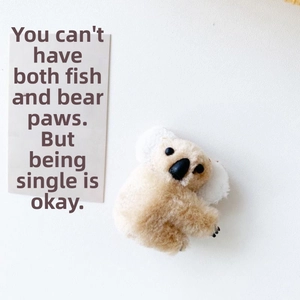 Close-up of a cute 3D plush koala hair clip with soft fur and realistic stitched details