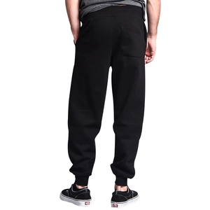 Rear view of men's black joggers featuring a back pocket and elastic cuffed ankles