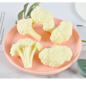 Realistic PVC cauliflower models in a cream yellow hue displayed on a stylish tray