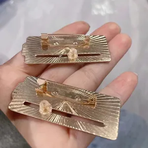 Golden mood tracker metal brooch with sliding energy level scale and pin back