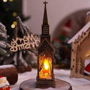 Detail of vintage Christmas lantern with LED reindeer scene and bronze church design