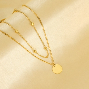 Double-layered 18K gold plated stainless steel necklace with beads and round pendant