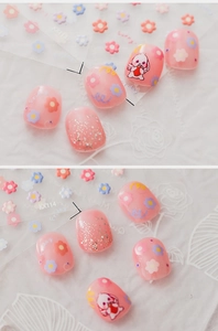 Detailed view of floral nail stickers featuring pink bunny and flower patterns KX114