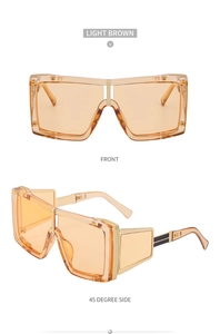 Detail view of oversized light brown steampunk sunglasses with square frames and side panels
