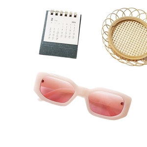 Retro square thick frame sunglasses in nude pink with tinted lenses on white background