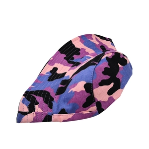 Detail of a foldable camouflage bucket hat showing vibrant pink and purple patterns