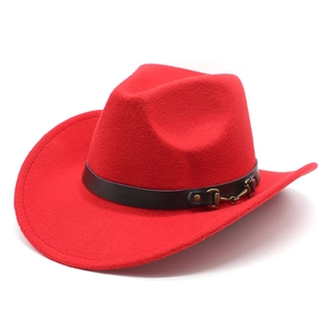 Detail of red wool cowboy hat featuring a black leather belt with a metal horsebit buckle