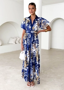 Detailed macro view of the blue and white baroque print dress with high-waist belt