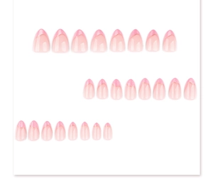 Macro detail of 24pcs almond press-on nails with pink French tips and gold outlines