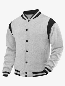 Detail of the knit varsity jacket showing snap button closure and ribbed collar