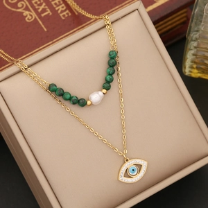 Double-layer gold necklace with green malachite beads, pearl, and evil eye pendant charm