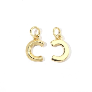 Detail of 18K gold-plated letter C pendant with shimmering cubic zirconia stones