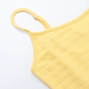Detail of yellow ribbed knit fabric with delicate spaghetti straps and neckline