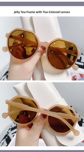 Detail view of jelly tea brown frame and gradient lenses on oversized sunglasses