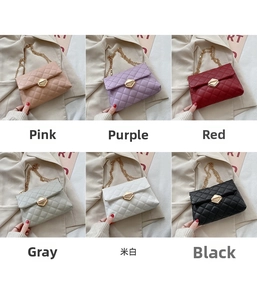 Detail view of quilted chain bags in pink, purple, red, gray, off-white, and black