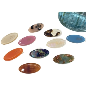 Colorful handmade acrylic oval hair clips and rhinestone hairpins in various patterns