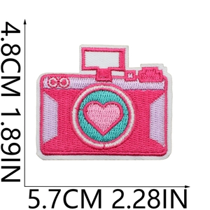 Pink camera embroidery patch with heart detail showing 4.8cm by 5.7cm size measurements