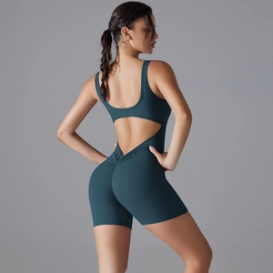 Close-up of teal yoga bodysuit featuring open back cutout and scrunch butt detail