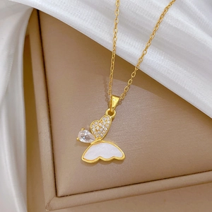 Elegant gold butterfly pendant necklace with zircon and shell inlay on silk fabric