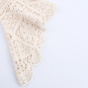 Crochet hollow knit sweater in creamy white featuring detailed floral and geometric patterns