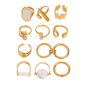 11-piece gold zircon ring set with pearls and geometric metal designs on white background