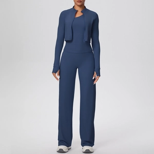 Detail of navy blue three-piece yoga set with zip jacket, tank top and wide-leg pants