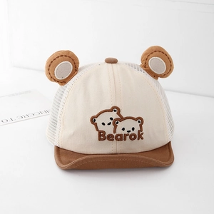Detail of baby summer cap with breathable mesh layer and cute bear embroidery design