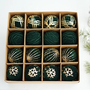 Detail of 16 dark green flocked Christmas balls with gold glitter patterns in a craft box