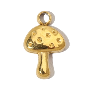 Macro shot of a golden mushroom pendant made of stainless steel with embossed dot textures