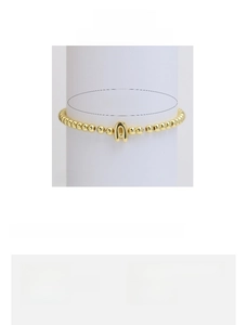Detail view of 18k gold plated bead bracelet with letter A charm and sizing specs