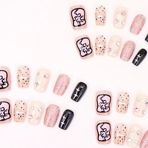 Pink glitter star press-on nails set with rhinestone accents and heart art designs