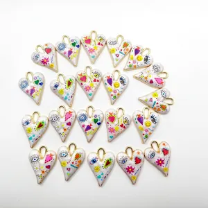 DIY heart-shaped charms with colorful evil eye and floral patterns for jewelry making