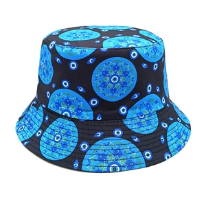 Detailed view of bucket hat with blue mandala patterns and Turkish evil eye motifs