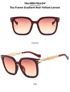 Detail of trendy oversized sunglasses with wine red frames and gold chain temples