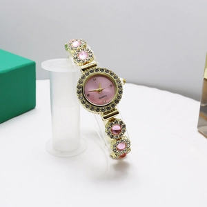 Elegant gold bracelet watch for women with pink dial and sparkling rhinestone crystals