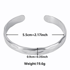 Adjustable silver stainless steel open bangle with unique hammered texture and measurements