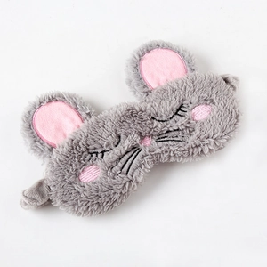 Detail of gray plush mouse sleep mask with soft fur texture and pink inner ears