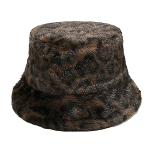 Detailed close-up of faux fur leopard print bucket hat with soft plush winter texture