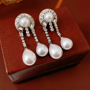 Silver needle pearl drop earrings with round pearls and sparkling rhinestone tassels