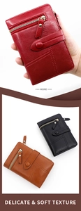 Detail of red, black, and brown PU leather tri-fold wallets with zip pockets and stitching