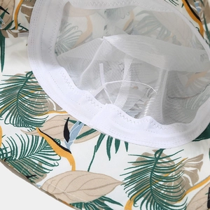 Foldable tropical palm leaf sun hat featuring breathable white mesh lining for women
