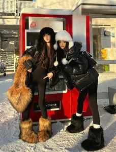 Brown heart-shaped plush handbag paired with long faux fur boots in an outdoor winter setting