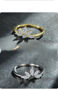 Detail view of 925 silver crown rings with marquise cut stones in gold and silver finish