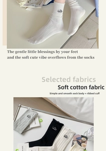 Detailed view of women's cotton crew socks with Celia embroidery and rolled cuffs