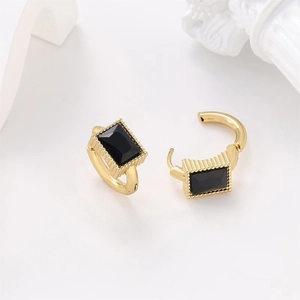 Detail of 304 stainless steel earrings with black rectangular stone and gold metal bead edge