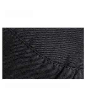 Detailed close-up of durable double-stitched seams on a black cotton flat top military cap